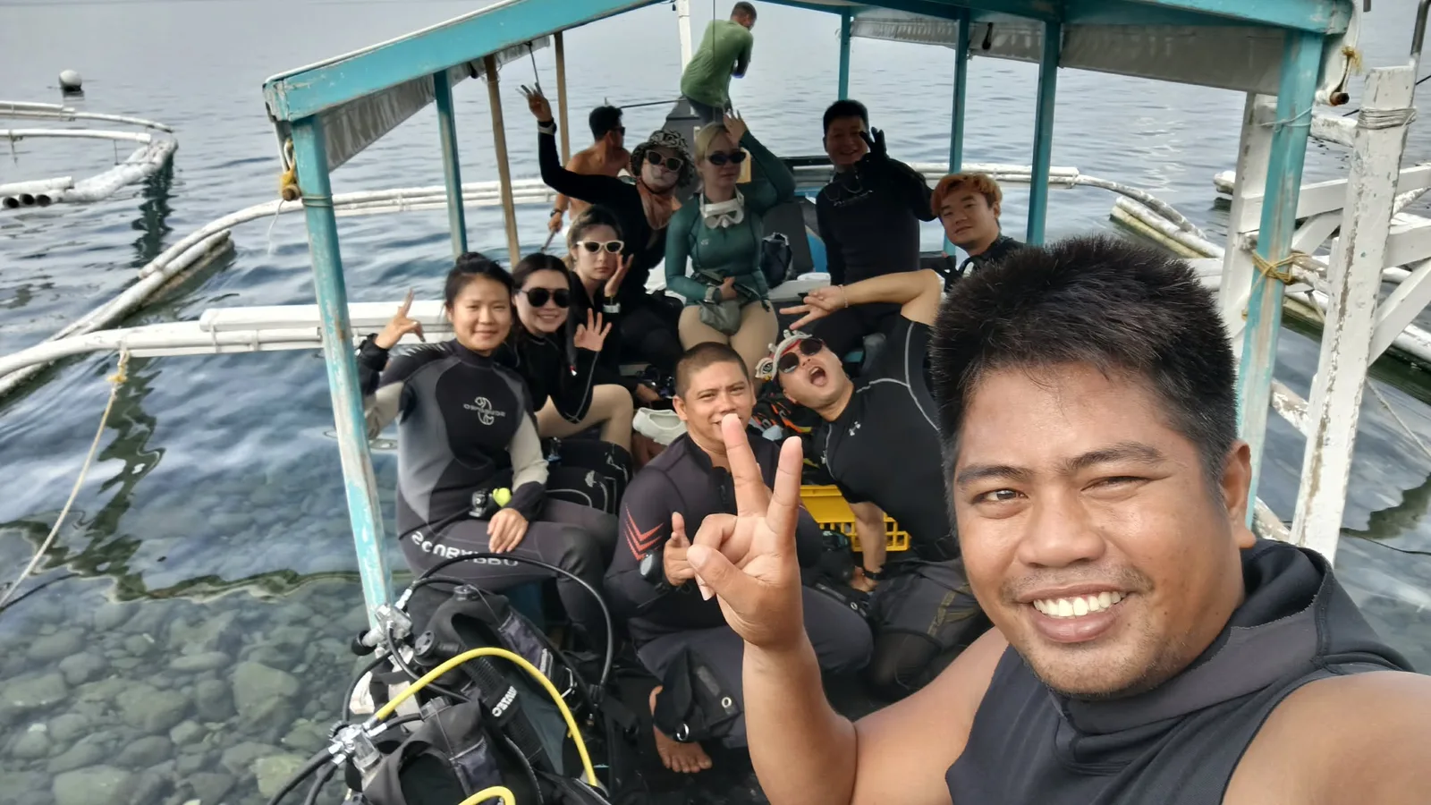 Jomel with divers on the boat in Anilao